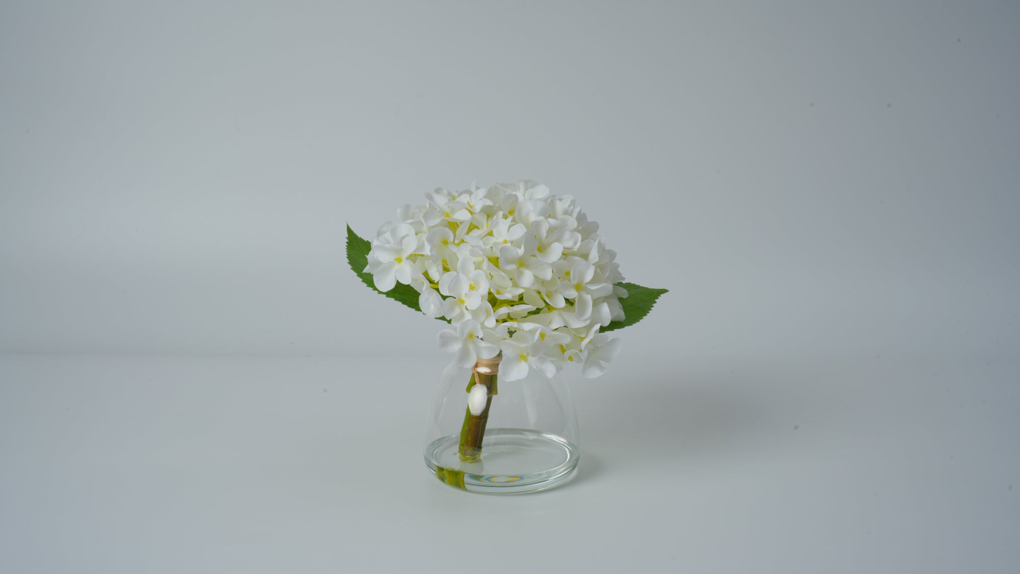 Clear Glass Vase with Faux Flower Arrangement