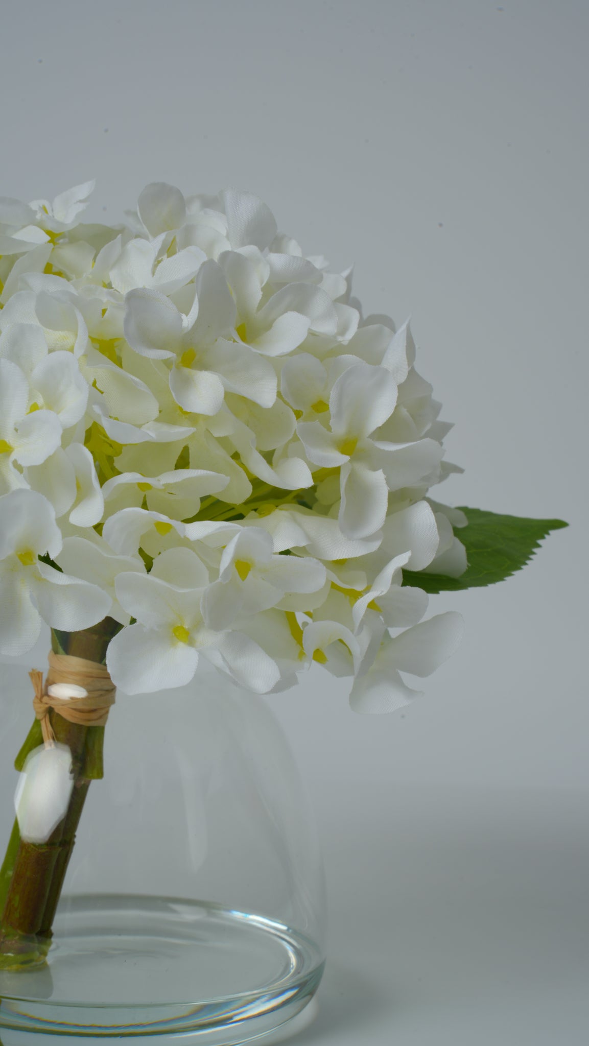 Clear Glass Vase with Faux Flower Arrangement