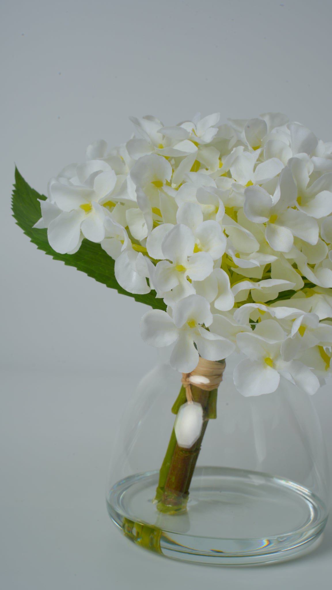 Clear Glass Vase with Faux Flower Arrangement