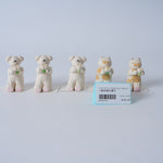 Small Animal Holding Flower Figurine