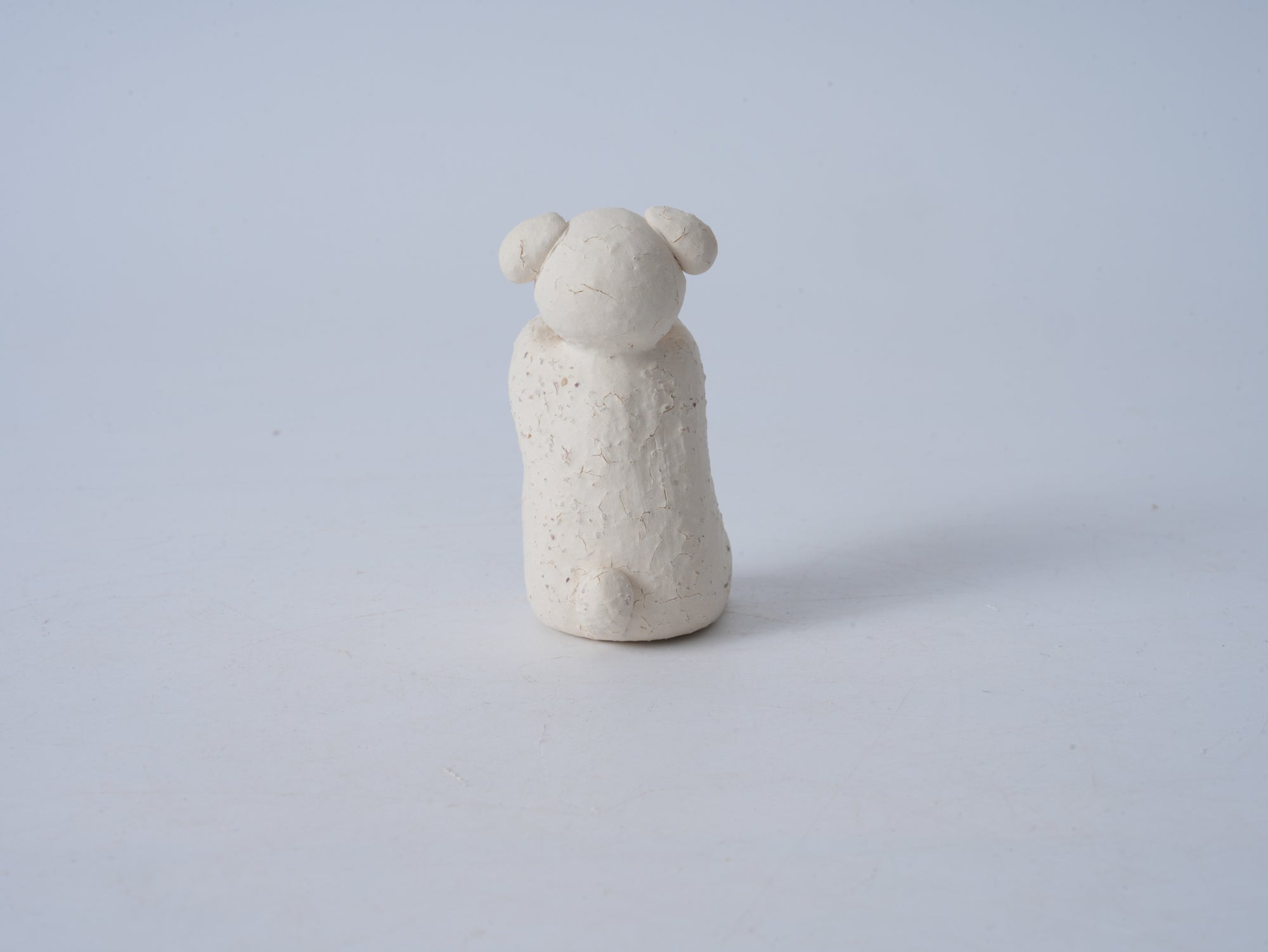 Small Animal Holding Flower Figurine