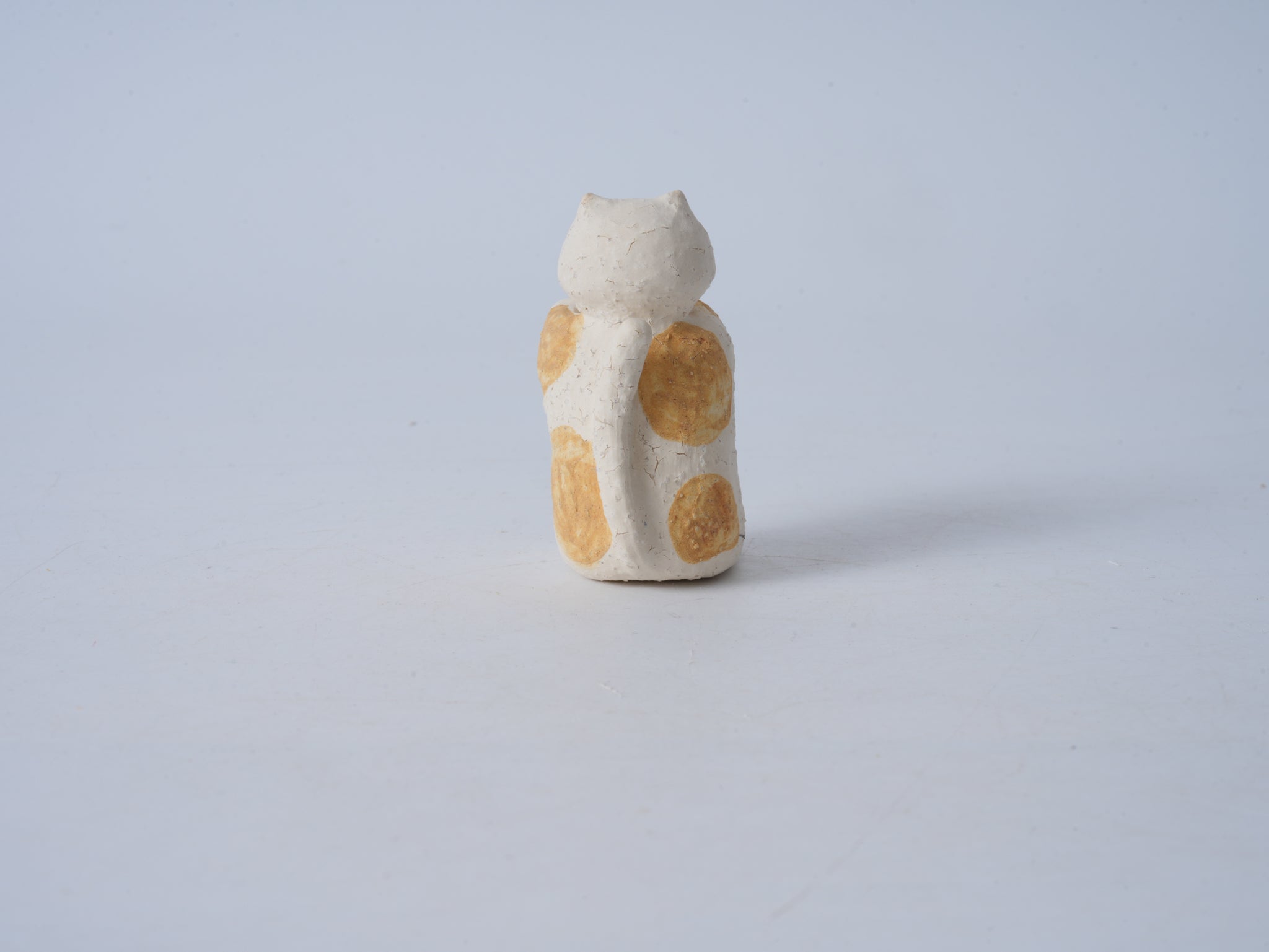 Small Animal Holding Flower Figurine