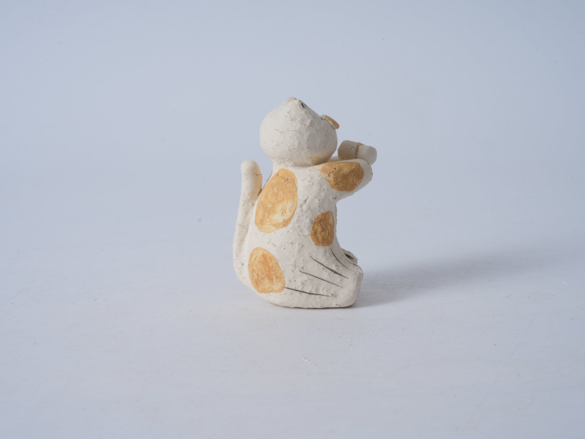 Small Animal Holding Flower Figurine
