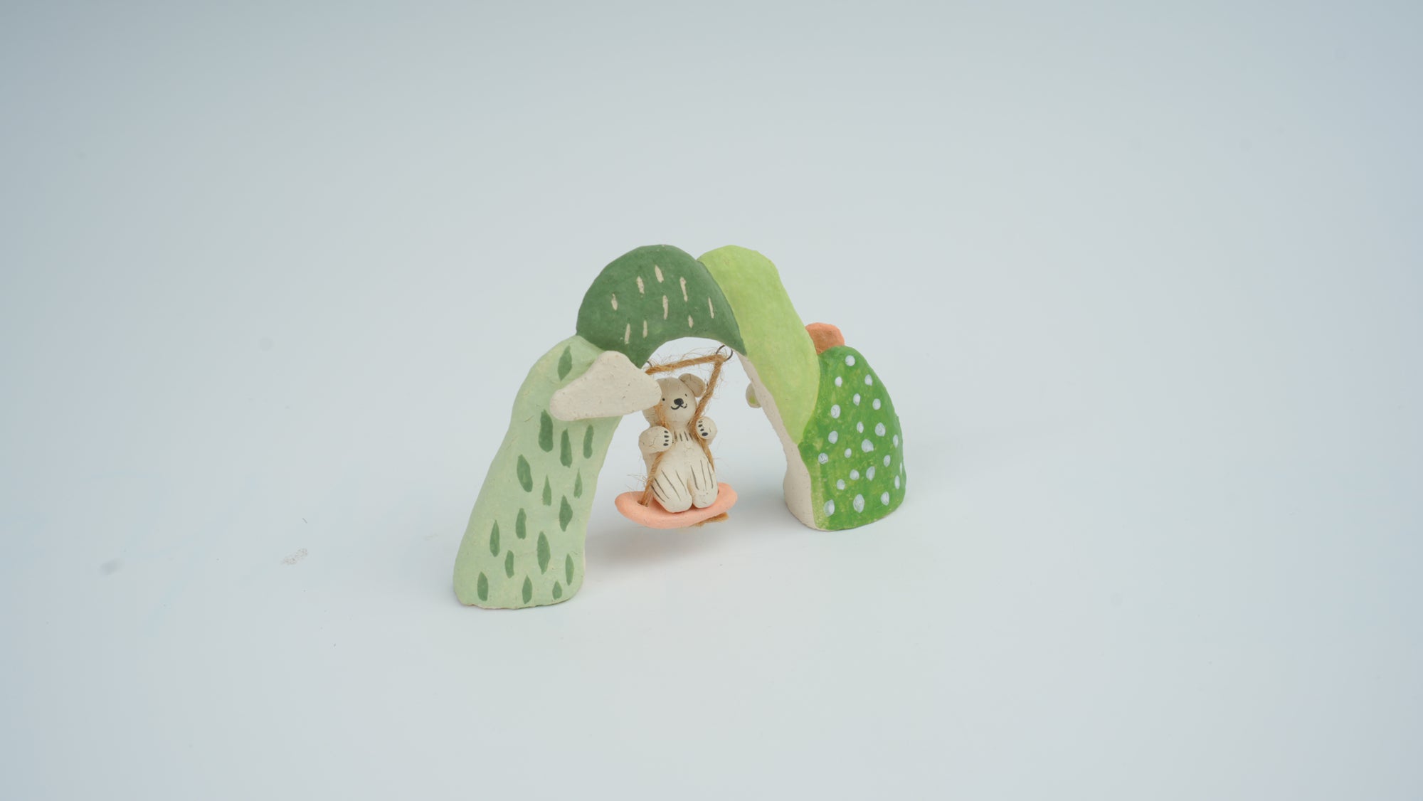 Small Animal on Swing Figurine