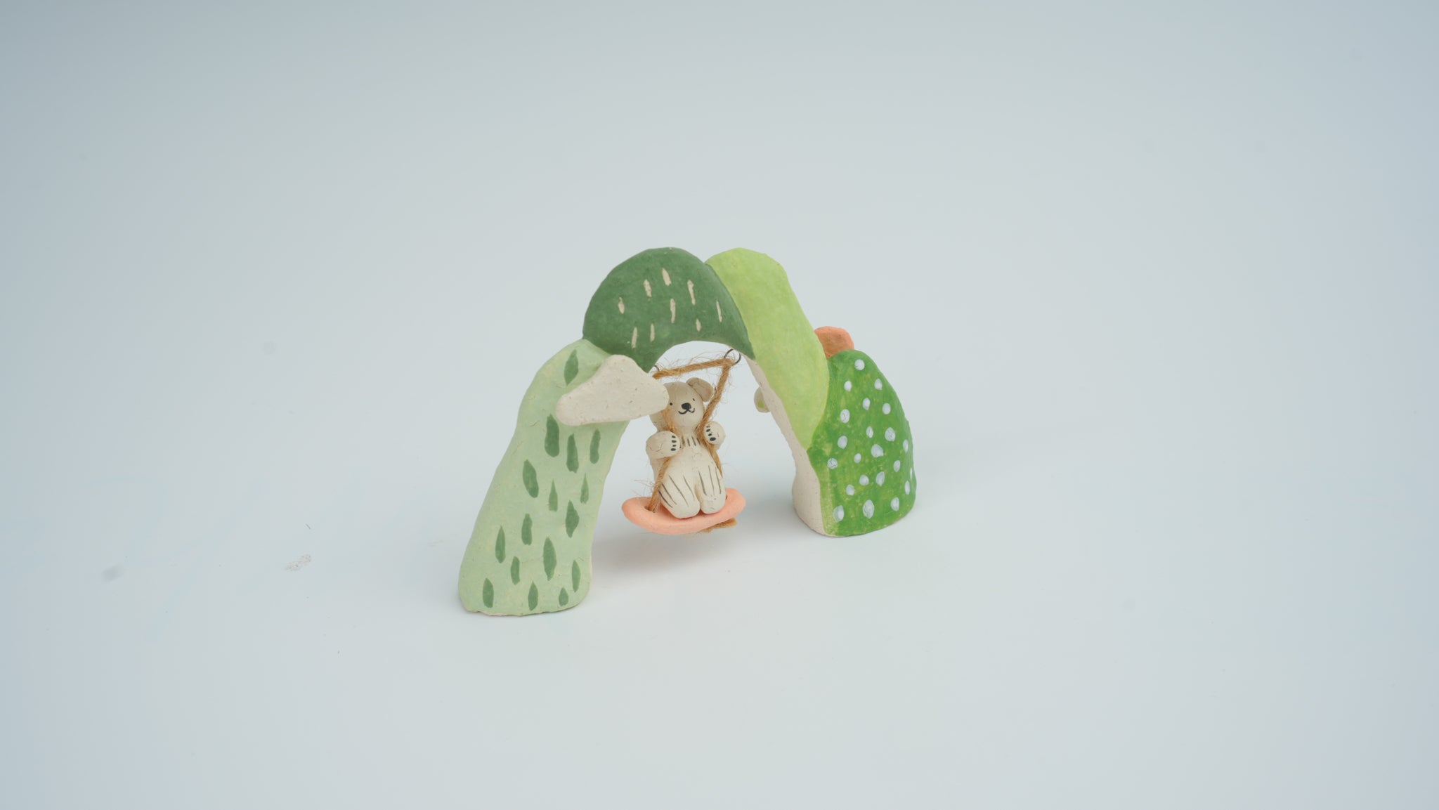 Small Animal on Swing Figurine