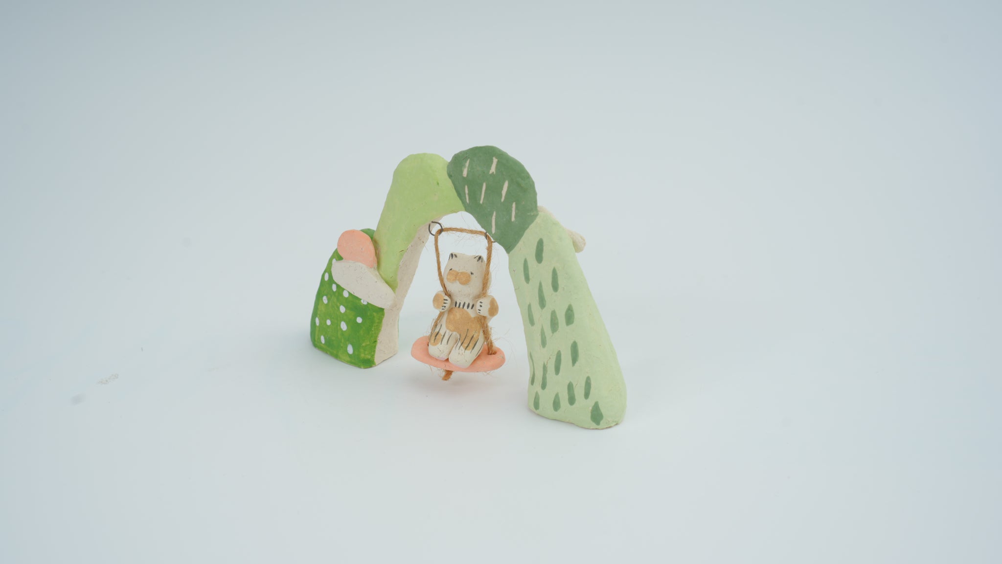Small Animal on Swing Figurine